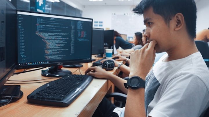 developer coding on a laptop